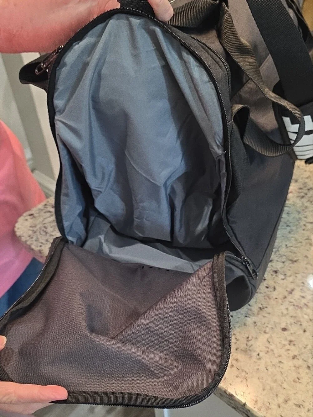 Nike Black Duffel Bag with White Swoosh and Branded Strap